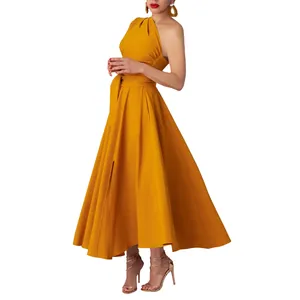 Detail of ochre one-shoulder sleeveless maxi dress with pleated waist and flared skirt