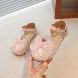 Elegant pink princess shoes for girls featuring a large mesh bow and silver butterfly motifs