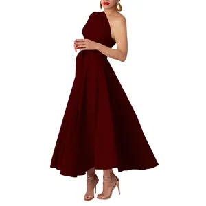 Side view of elegant one-shoulder burgundy maxi dress with belted waist and flared skirt