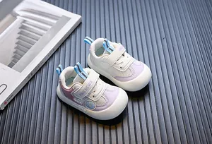 Close-up of mesh toddler walking shoes with soft sole and purple accents