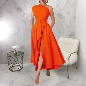Full view of an elegant orange one-shoulder maxi dress with waist belt and slit