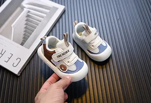 Close-up detail of breathable mesh baby toddler shoes featuring a donut patch and velcro strap