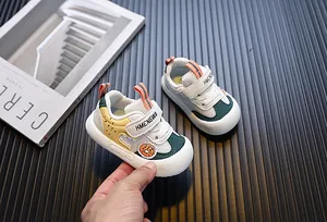 Close-up detail of breathable mesh toddler shoes with soft non-slip sole and Velcro strap