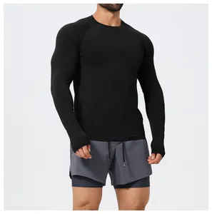 Close-up view of a men's black slim-fit seamless long-sleeve sports T-shirt for fitness