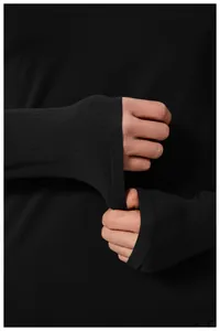 Close-up detail of thumbhole cuffs on black seamless men's sports long sleeve top