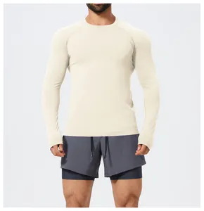 Front view of a model wearing a slim fit off-white seamless long sleeve athletic t-shirt