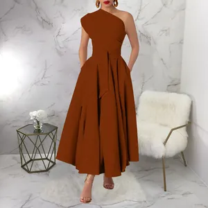 Elegant brown one-shoulder sleeveless maxi dress with cinched waist and full skirt on model
