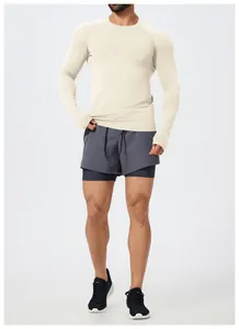 Full body view of men's slim fit seamless long sleeve athletic t-shirt in beige color