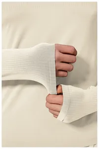Detailed macro view of thumbhole cuffs on men's seamless slim-fit athletic long-sleeve top