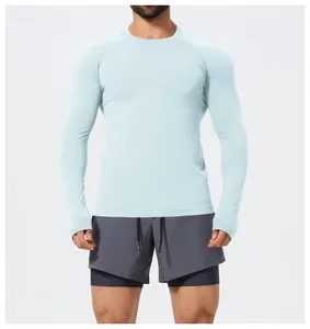 Front view of a men's slim fit seamless long sleeve sports T-shirt in light blue