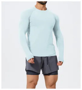 Detailed view of men's slim-fit seamless long-sleeve athletic shirt in mint green
