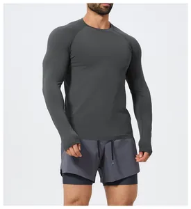 Detail view of men's seamless slim-fit long-sleeve sports T-shirt in dark grey.