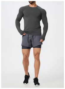 Front view of men's slim-fit seamless long-sleeve athletic top in dark grey finish