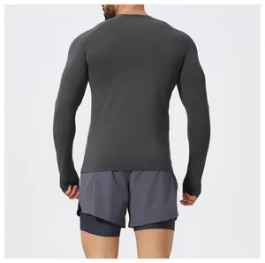 Detailed back view of men's slim-fit charcoal grey long-sleeve seamless athletic shirt.