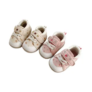 Cute cartoon baby walking shoes with soft soles and velcro straps
