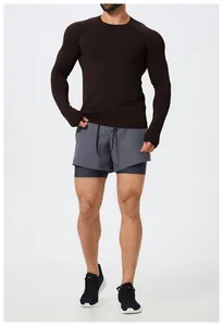 Slim fit seamless long sleeve sports T-shirt for men in dark brown studio shot