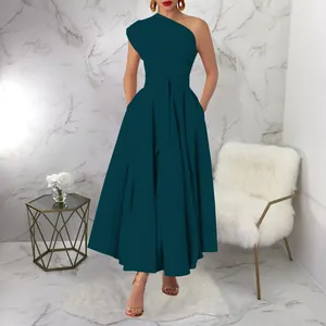 Lifestyle shot of an elegant dark teal one-shoulder pleated A-line maxi dress
