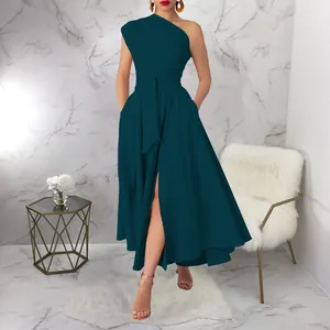 Detail of teal one-shoulder sleeveless maxi dress with belted waist and side slit