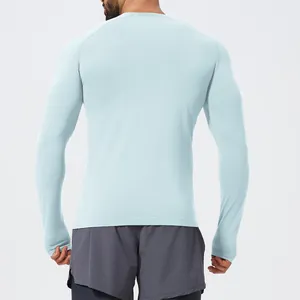 Back view of men's light blue seamless long sleeve athletic compression t-shirt