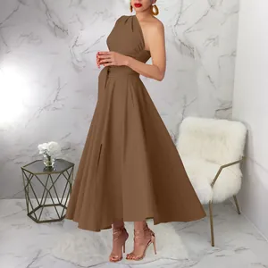 Full length sleeveless one-shoulder brown maxi dress with waist tie and flared skirt