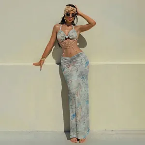 Sexy tie-dye halter maxi dress featuring decorative pearl chains and slim fit cutout design