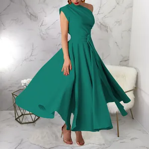 Elegant teal one-shoulder maxi dress with belted waist and flowing big swing skirt.