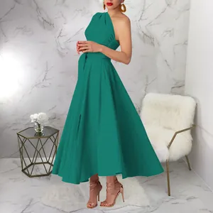 Detailed view of the one-shoulder green maxi dress with belted waist and full swing skirt