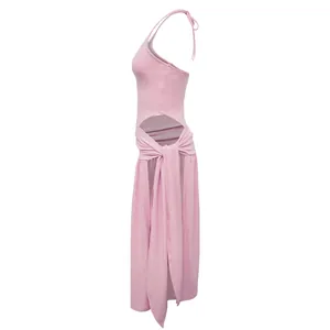 Side profile of a pink solid color lace-up sexy slit skirt set for women