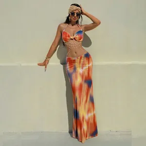 Sexy halter backless dress with vibrant tie-dye print and pearl chain decorations