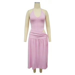 Full view of pink two-piece set featuring a halter bodysuit and high-slit wrap skirt