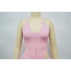 Close-up detail of a pink halter neck top and matching split skirt set on mannequin.
