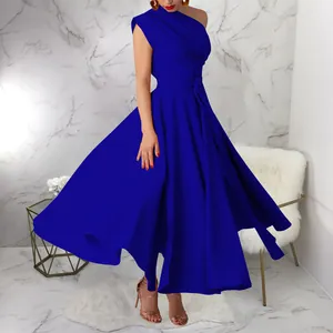 Detailed view of an elegant royal blue one-shoulder maxi dress with a flowing flared skirt