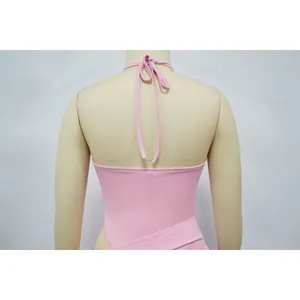 Back view detail showing the halter ties of a pink sexy skirt set on mannequin