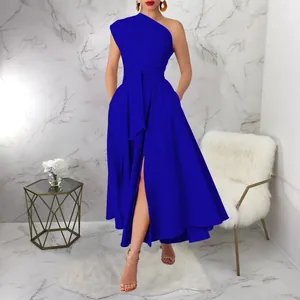 Close-up detail of a royal blue one-shoulder maxi dress featuring a high slit and waist tie