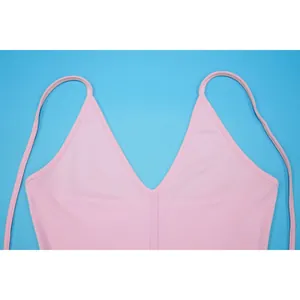 Detailed close-up view of a pink V-neck camisole top featuring thin elegant shoulder straps