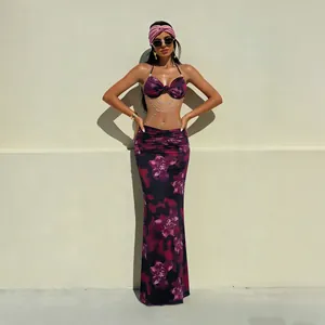 Stylish floral halter maxi dress set featuring elegant pearl chain waist detail