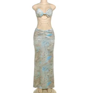 Full view of slim halter neck dress with bead chain waist and blue marble print