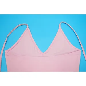 Close-up of pink V-neck strappy top showing fine stitching and smooth fabric texture detail