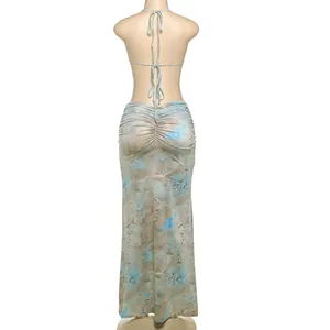 Back view of sexy halter backless tie-dye maxi dress with delicate bead chain detail