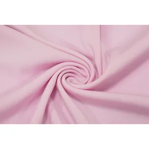 Macro shot of soft pink fabric texture showing fine knit details for a sexy skirt set