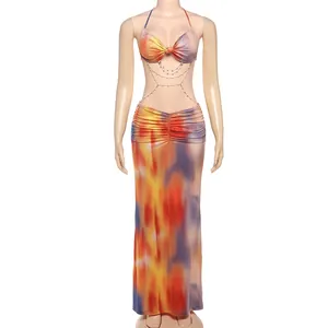 Detail of halter neck top with bead chain and colorful tie-dye long skirt set.