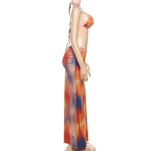 Side view of sexy halter dress with tie-dye pattern and delicate bead chain detail.