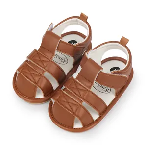 Detailed top view of brown faux leather baby sandals with comfortable adjustable velcro straps