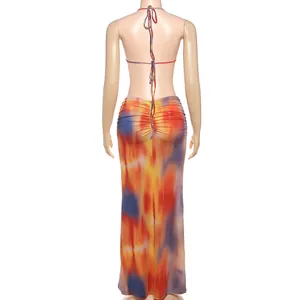 Detailed back view of a vibrant tie-dye halter top and ruched bodycon maxi skirt