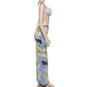 Side view of floral halter dress with bead chain details on a mannequin.