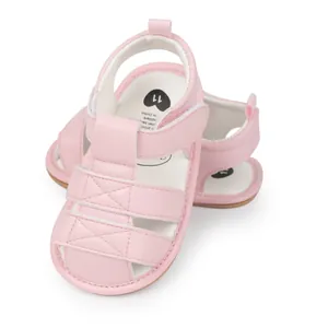 Detailed view of pink infant sandals with soft rubber sole and heart pattern insole