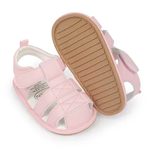 Detailed view of pink baby sandals with non-slip soft rubber soles for toddlers