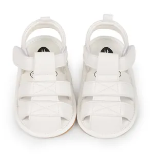 Detailed top view of white breathable infant sandals with non-slip soft rubber soles