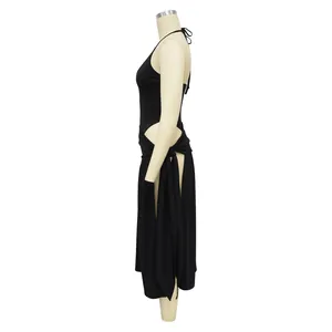 Side view of sexy black halter neck top and high-slit wrap skirt set on mannequin