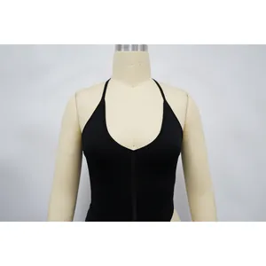 Detail view of a black halter neck bodysuit with a deep plunging V-neckline design